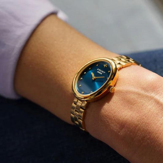 RELOGIO CAUNY AMBER 24X32MM MST AZUL. CX DOU. BR AÇO DOURADO