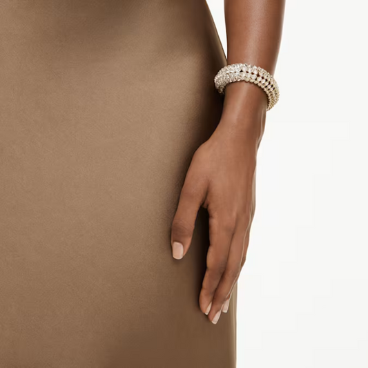 PULSEIRA SWAROVSKI IDYLLIA LAPIDAÇÃO OVAL, BRANCA, LACADO A DOURADO