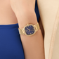 RELÓGIO GUESS TAPESTRY DOURADO COM MOSTRADOR AZUL