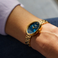 RELOGIO CAUNY AMBER 24X32MM MST AZUL. CX DOU. BR AÇO DOURADO