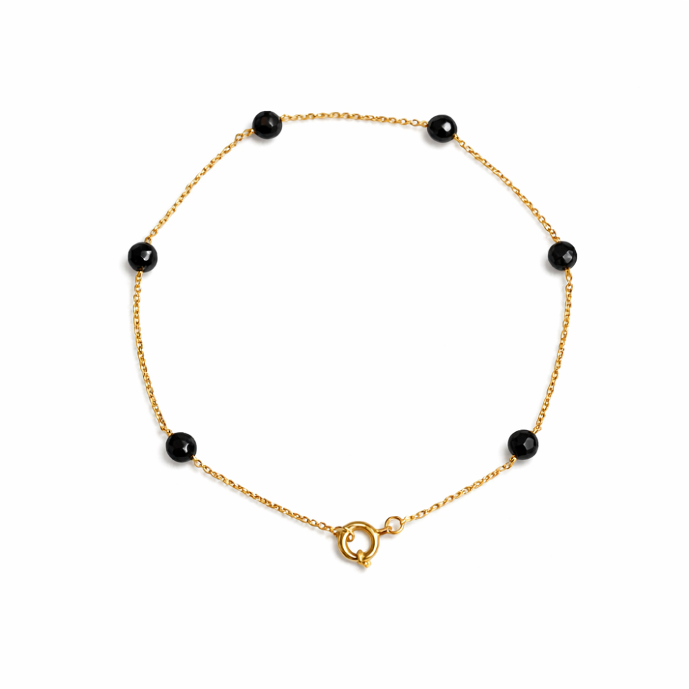 PULSEIRA EM OURO 19,2K C/ PEDRAS ONIX PRETAS