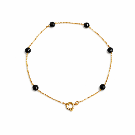 PULSEIRA EM OURO 19,2K C/ PEDRAS ONIX PRETAS