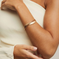 ESCRAVA VIDAL & VIDAL EM BRONZE COM BANHO DE OURO 18K