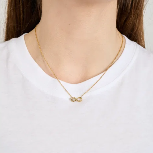 COLAR GUESS EM AÇO DOURADO COM INFINITO E ZIRCONIAS