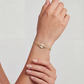 PULSEIRA GUESS MARINA DOURADA EM AÇO E ZIRCONIAS