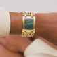 RELÓGIO GUESS DOURADO COM MOSTRADOR VERDE
